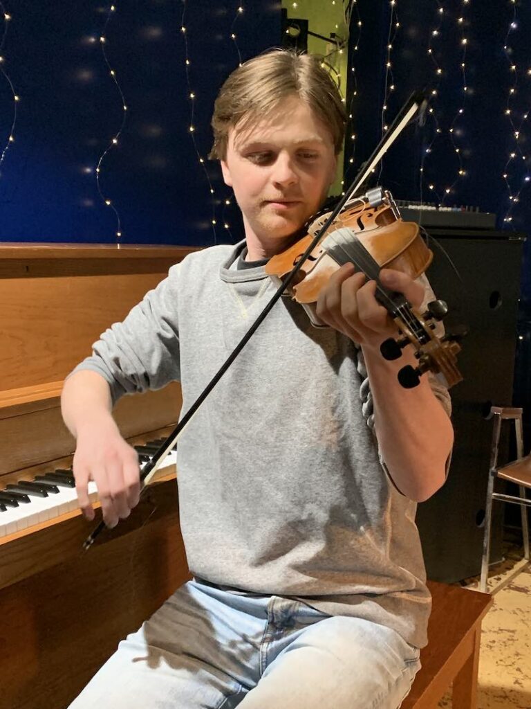Iain playing the fiddle.