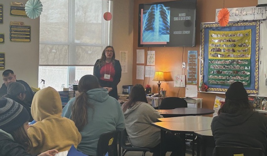 Students attending a presentation for healthcare in a classroom.